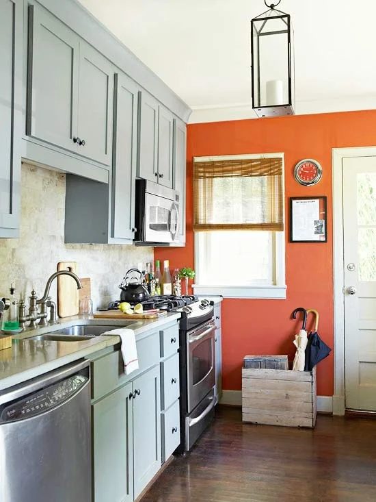 gray kitchen orange accent wall, traditional home @Bekob