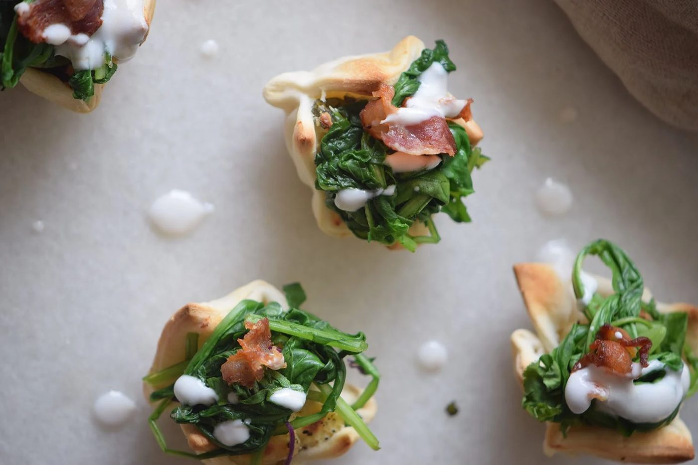 A yummy and pretty appetizer to share at your next party! Cream Cheese Spinach Puffs via Bekob.com