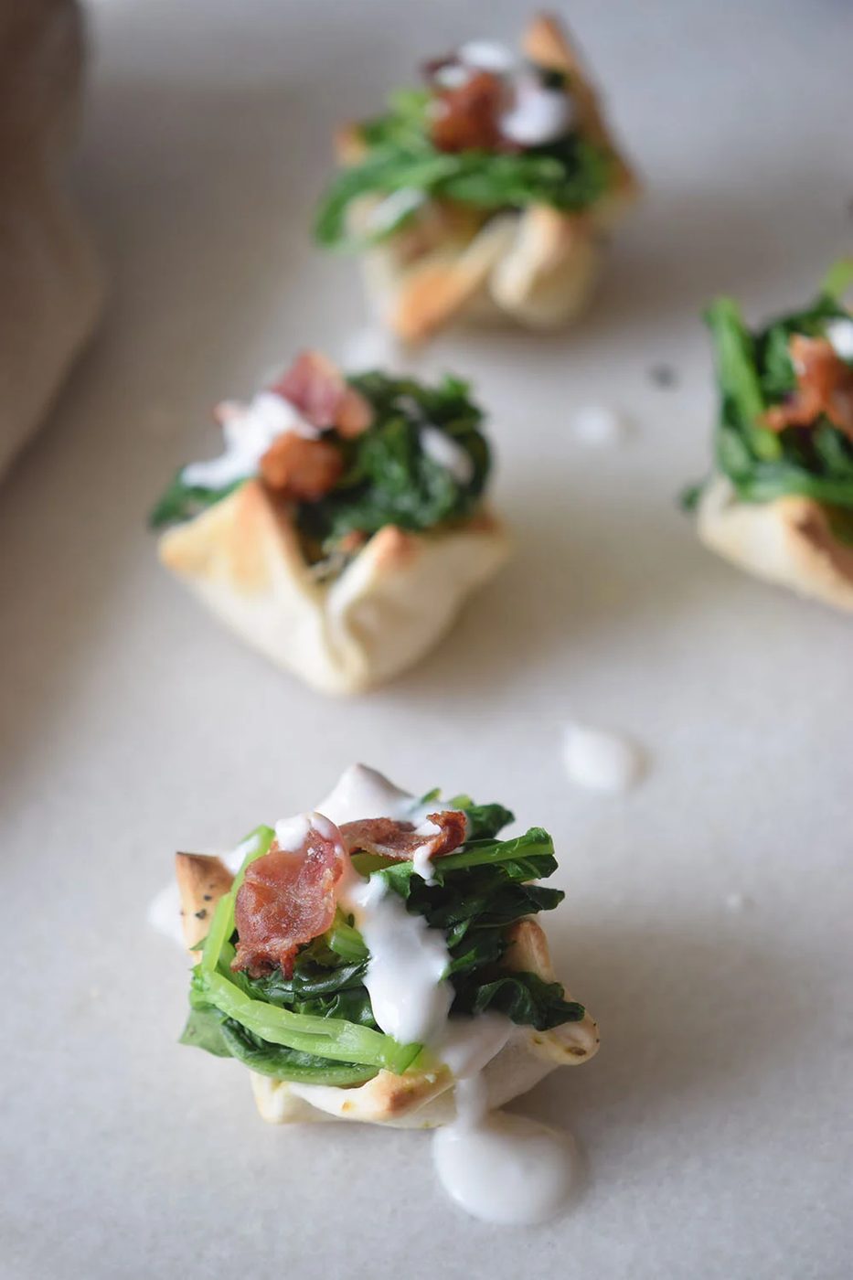 A yummy and pretty appetizer to share at your next party! Cream Cheese Spinach Puffs via Bekob.com