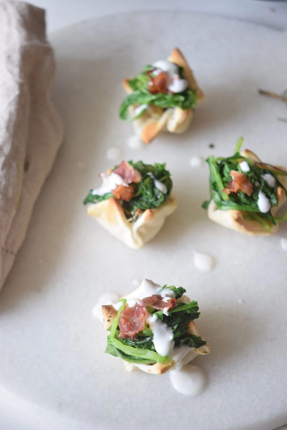 A yummy and pretty appetizer to share at your next party! Cream Cheese Spinach Puffs via Bekob.com