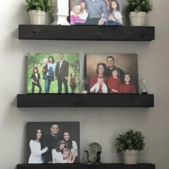 Handmade Black Floating Shelves With Photos Displayed