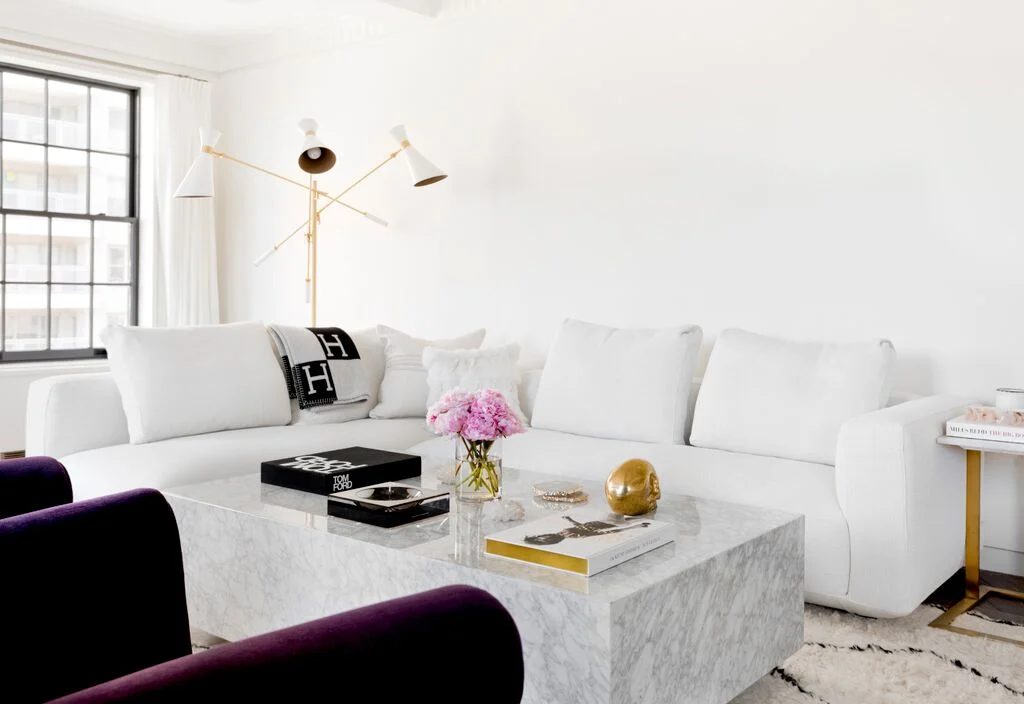 Lovely neutral black and white living room. Love the marble coffee table!