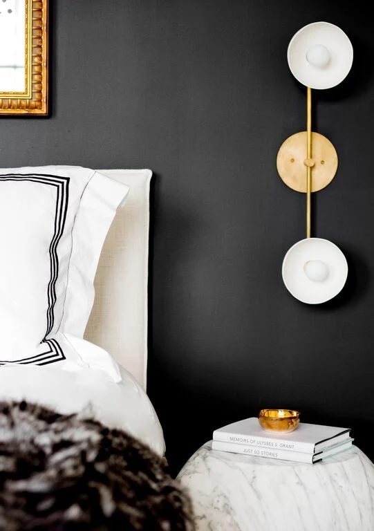 Black and white with marble and gold. That bedside lamp is memorable, and this room is vivid! (designed by Tamara Magel via @Bekob)