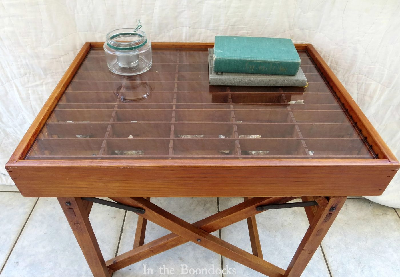 upcycled broken director's chair and cassette tape organizer into a strong display table - In The Boondocks on Bekob (6)