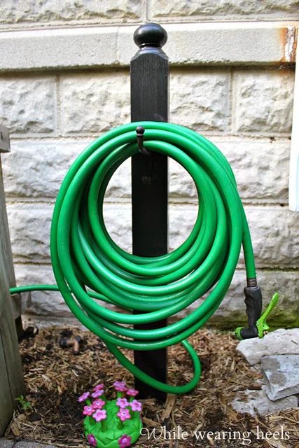 Handmade garden hose holder
