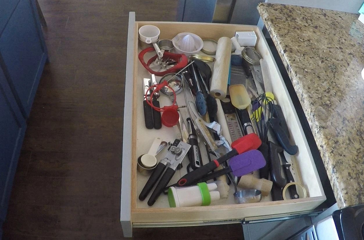 Messy drawers be gone. A direct no nails or glue solution with a utensil drawer organizer featured on Bekob.com