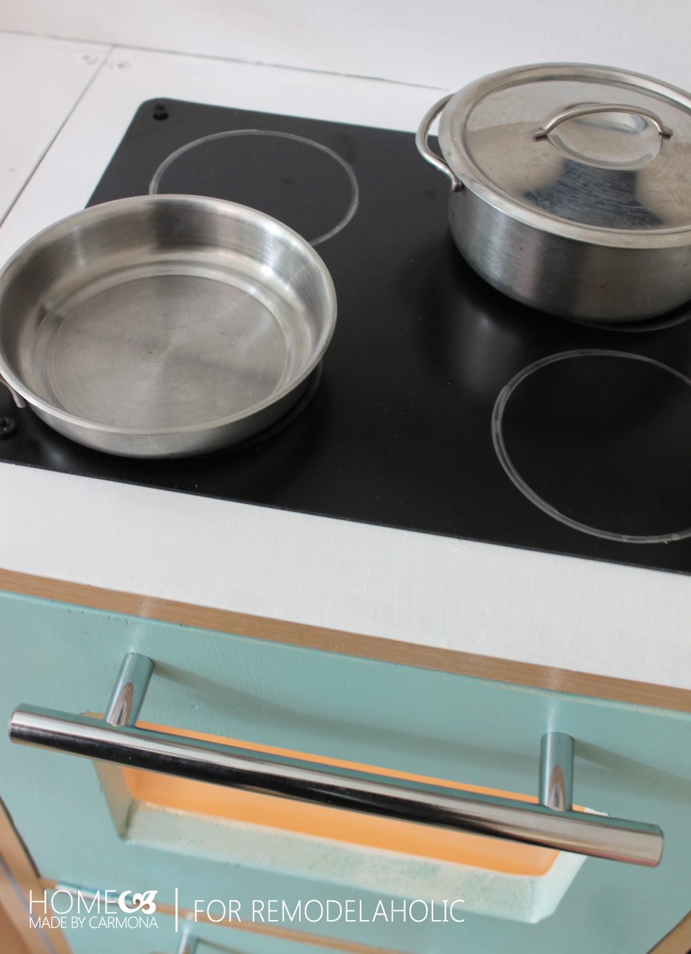 This kids kitchen playset is so cute -- a faux double oven plus a convection stove, low-cost and straightforward.