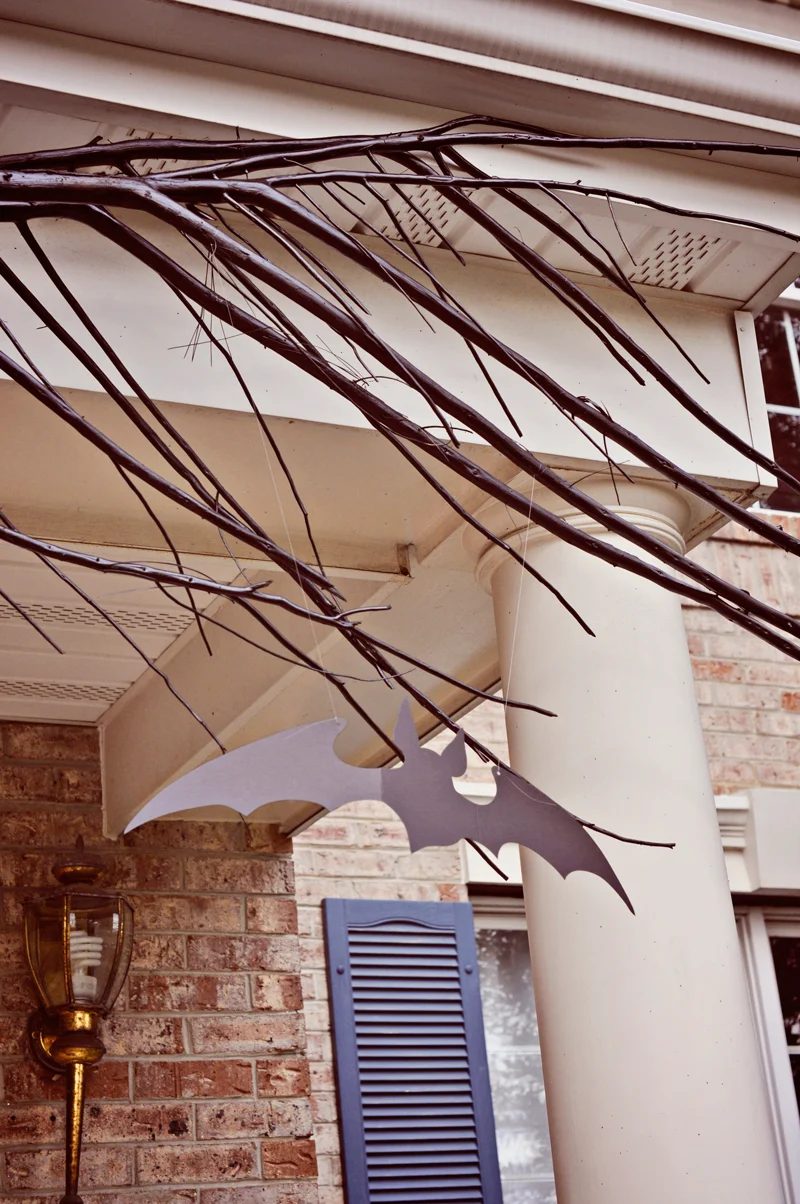 Branches hung from the porch and cardboard or paper bats, so straightforward! | direct Halloween Decor options and Tutorials at Bekob.com