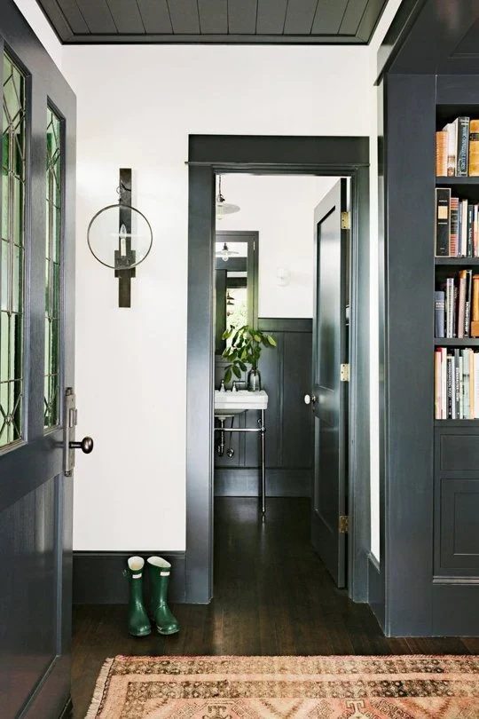 black baseboard and door trim (via Apartment Therapy)