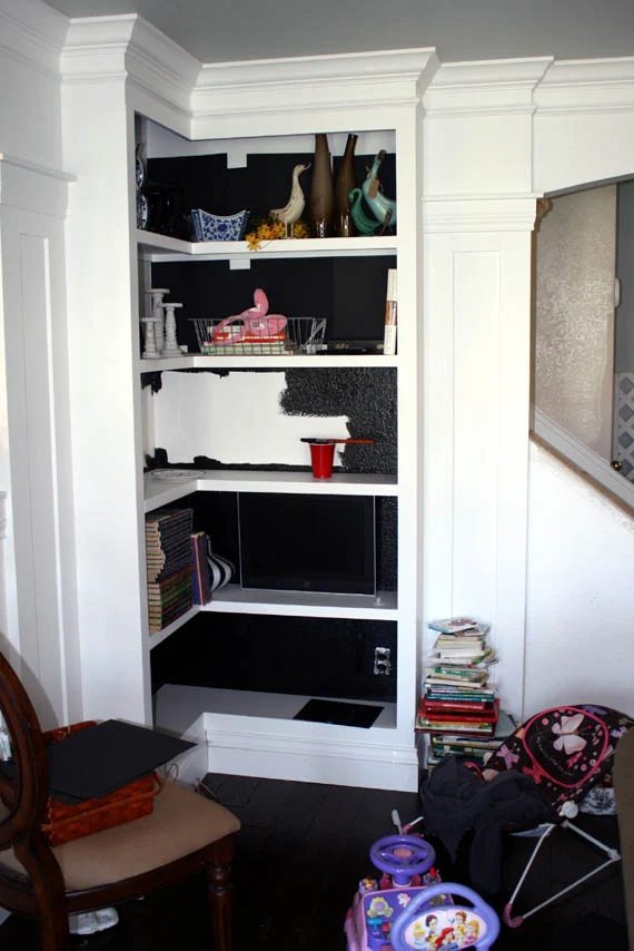 paint bookcase interiors black (test with paper first to see how you like it)