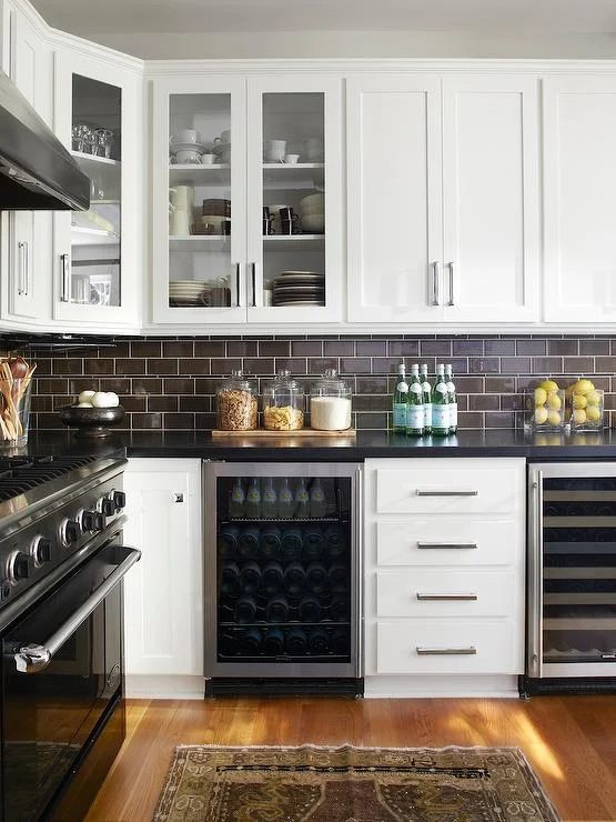 dark subway tile backsplash, BM clearly White cabinets (Urrutia Design via DecorPad)