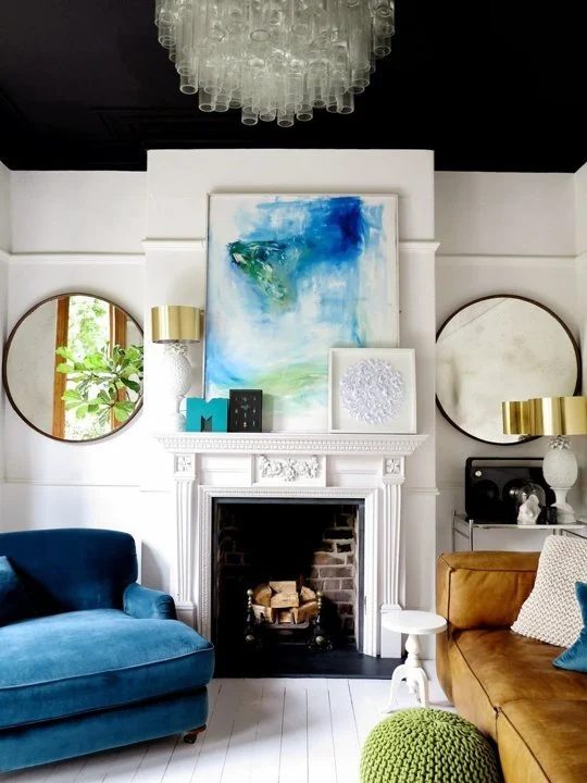 black painted ceiling to make a tall ceiling cozy (via Apartment Therapy)