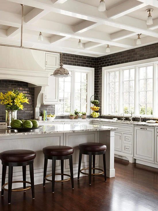 black subway tile backsplash in a black and white kitchen, coffered ceiling (BHG)