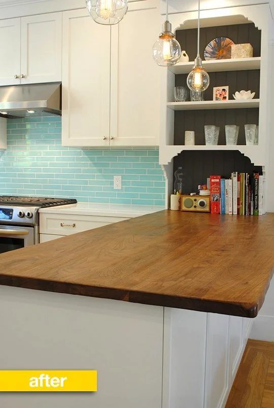 black painted inside kitchen bookshelf (via The Kitchn)