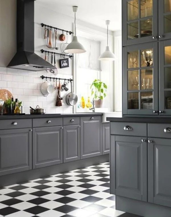 gray kitchen cabinets with black countertops (via Style Me Pretty)