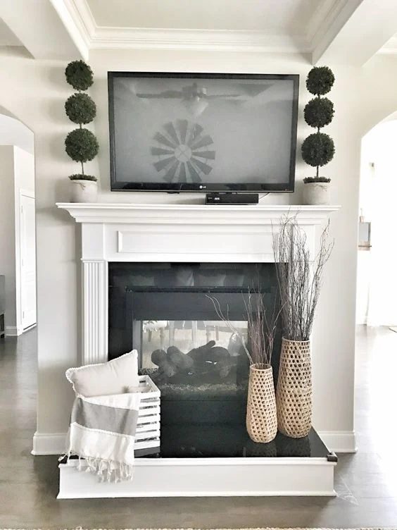options for Decorating Around a TV Over the Fireplace Mantel, direct farmhouse decor for a mantel and fireplace, via Bless this Nest
