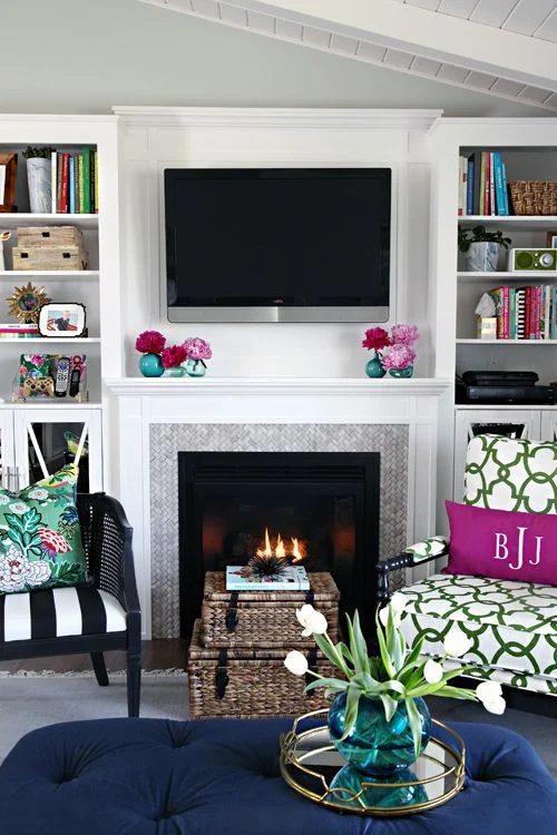 options for Decorating Around a TV Over the Fireplace Mantel, white fireplace mantel with builtins via I Heart Organizing