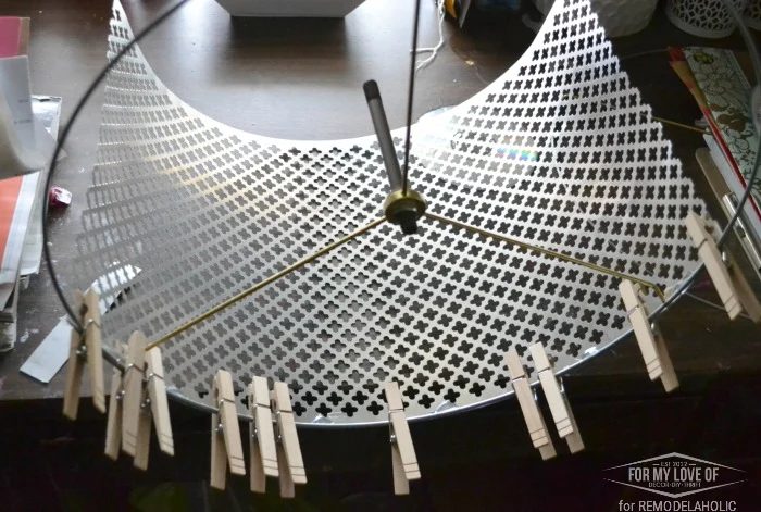 USE CLOTHESPINS TO CONNECT THE SHEET OF METAL TO THE LAMP RINGS