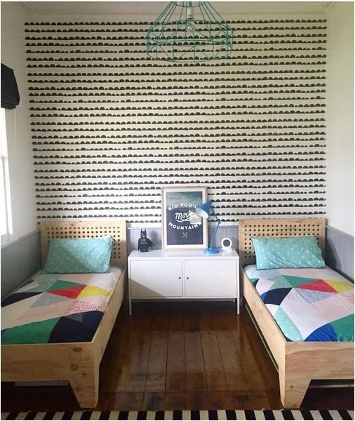 Shared Kids Space Inspiration - love the stamped style wallpaper and geometric quilts