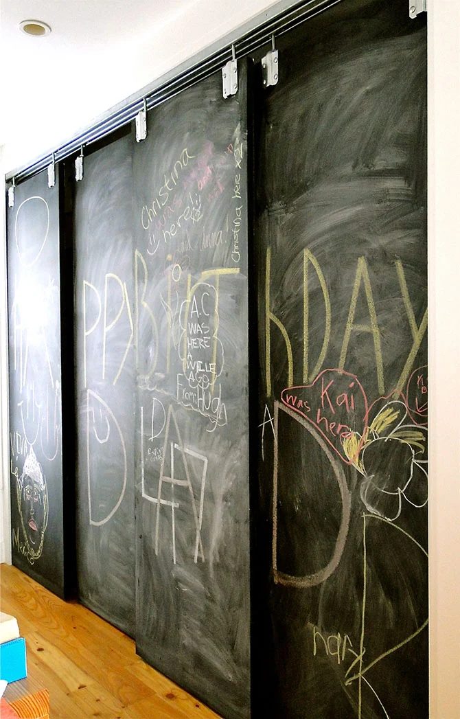 chalkboard bypass pantry doors hung using a barn door track - via Lynne Knowlton