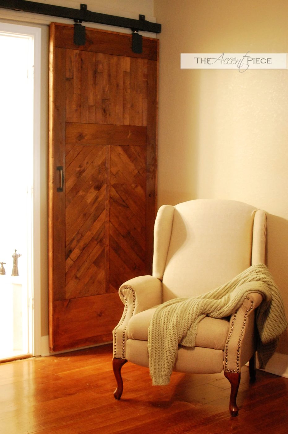 hardware to hang a Handmade wood barn door, using trolley tracks and hangers - The Accent Piece