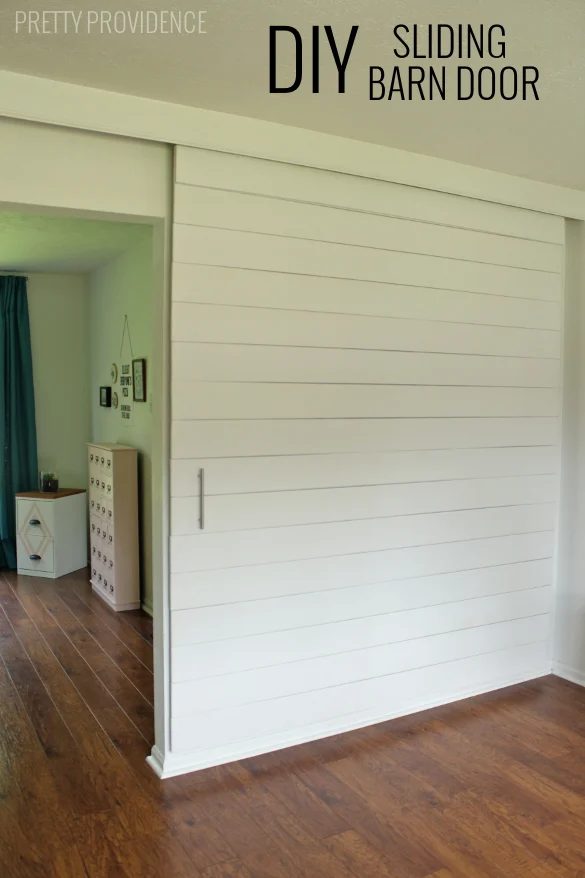 build an extra large sliding barn door with hidden hardware to close off an office - Pretty Providence