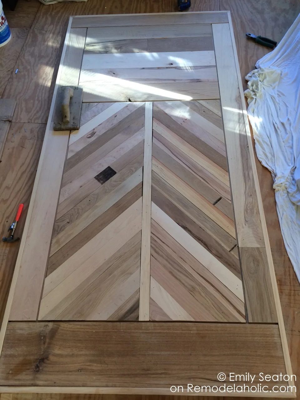 handmade herringbone barn door detail on a chevron barn door, woodworking plan