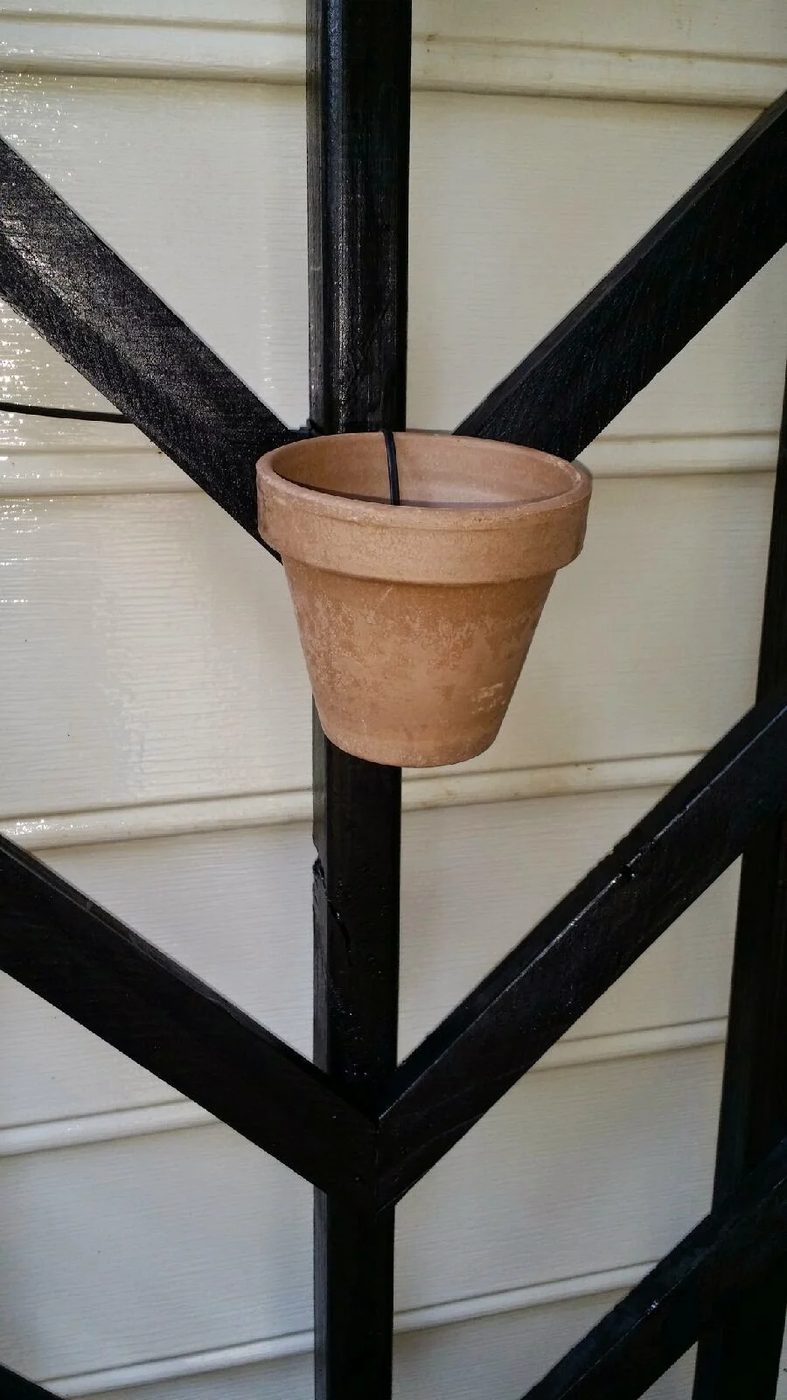 make a vertical garden by hanging flower pots on a tall Handmade chevron lattice - Easter Avenue Co on @Bekob