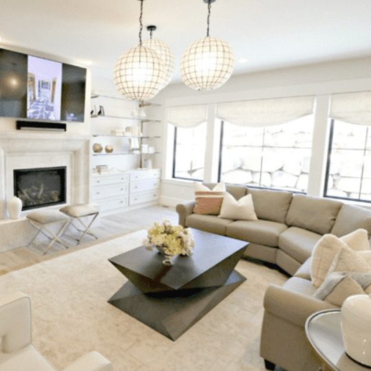 Neutral Transitional Style Living Room With Black Modern Table At Center