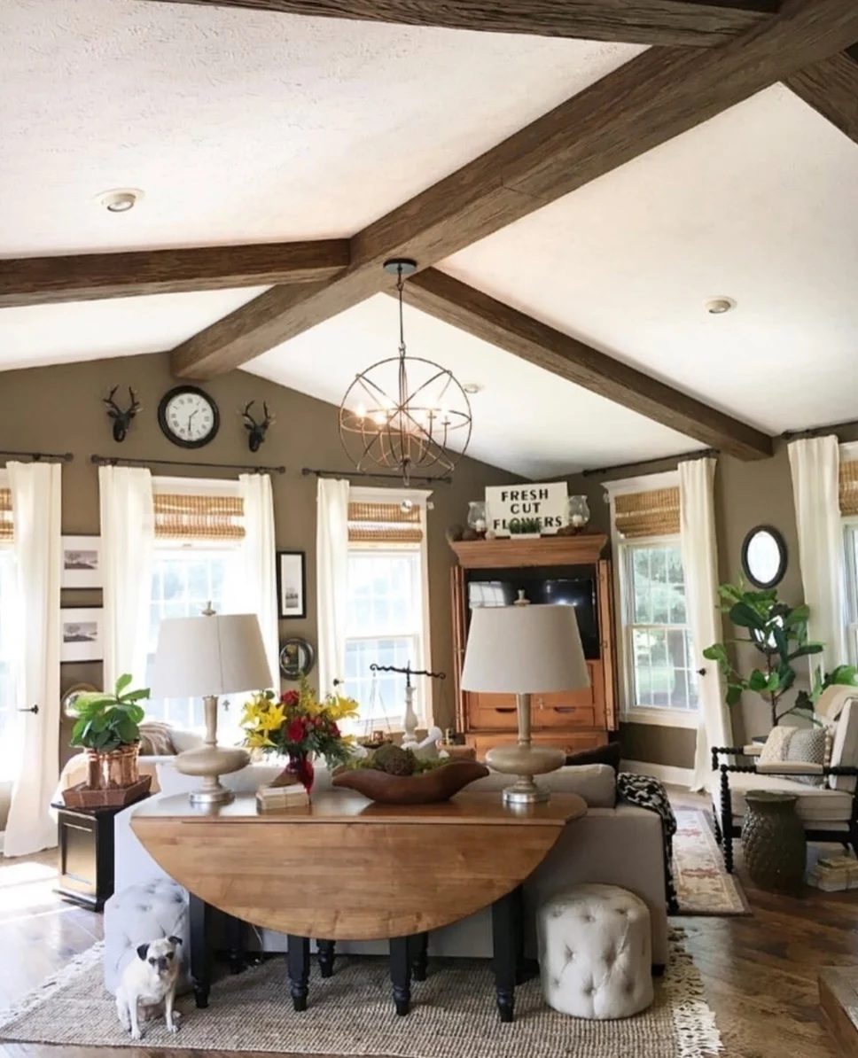 Living Room With Wood Beam Ceilings, Wood Table, Wood Floors