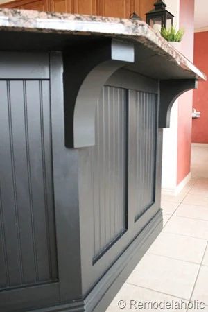 black painted board and batten kitchen island with corbels on Bekob