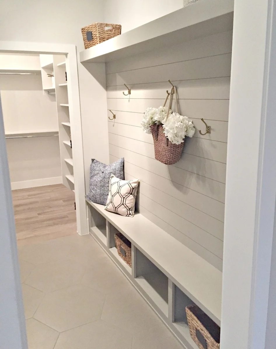 vivid Grey And White Mudroom Area With Shiplap Wall, Hooks, Cubbles, A Bench And Shelf