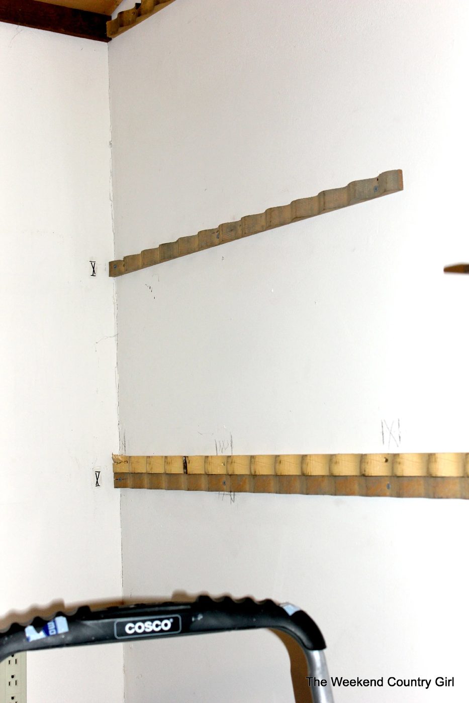 wood braces to install a corrugated tin wall treatment - The Weekend Country Girl featured on @Bekob