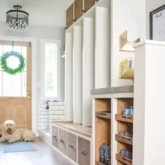 Entryway With White And Wooden Stained Accent Walls And Cubbies