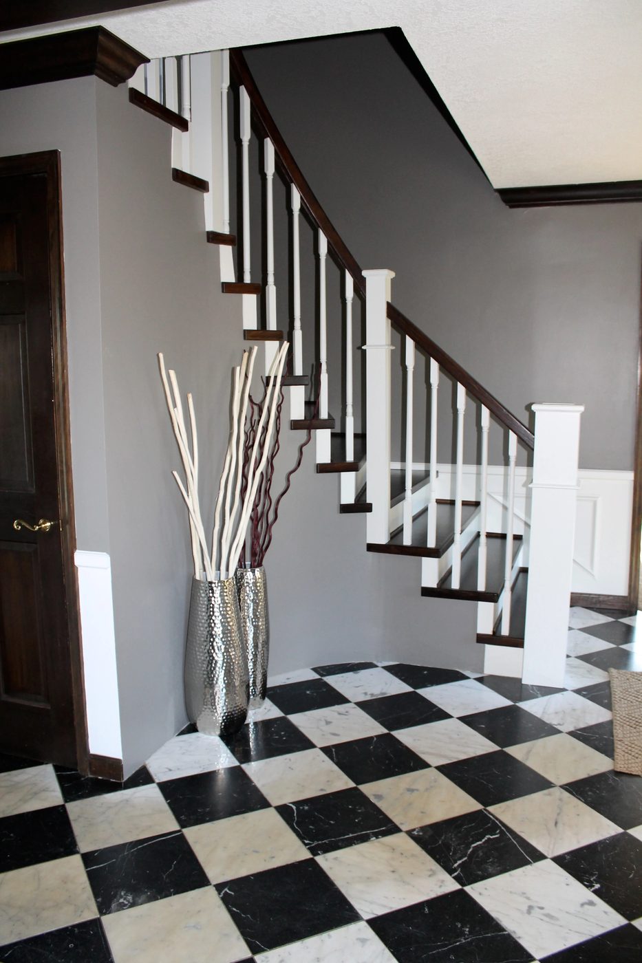 checkered tile floor and handmade wood staircase remodel - Construction2Style via @Bekob