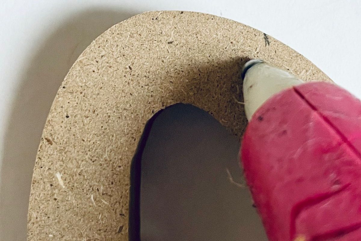 straightforward Handmade Dollar Tree Hello Wreath walkthrough (1) Glue Twine To Wood Cutout, Bekob