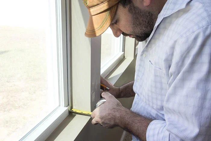 Measuring to cut perfectly for Handmade window trim featured on Bekob.com