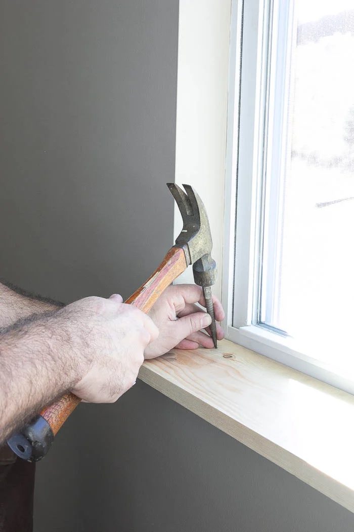 Nailing on window trim walkthrough featured on Bekob.com
