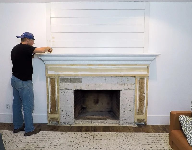 updated shiplap woodwork around an existing fireplace mantel and surround