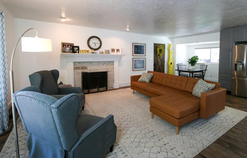 open concept floorplan living room before Handmade fireplace makeover