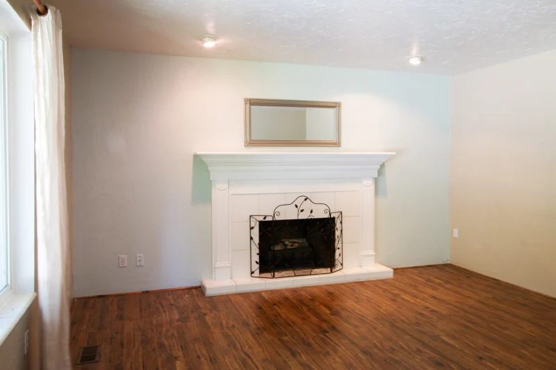 direct fireplace mantel with white tile and white painted mantel