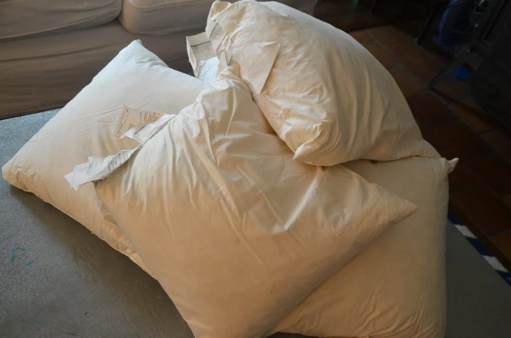 use old pillows to stuff a floor pouf, featured on Bekob.com