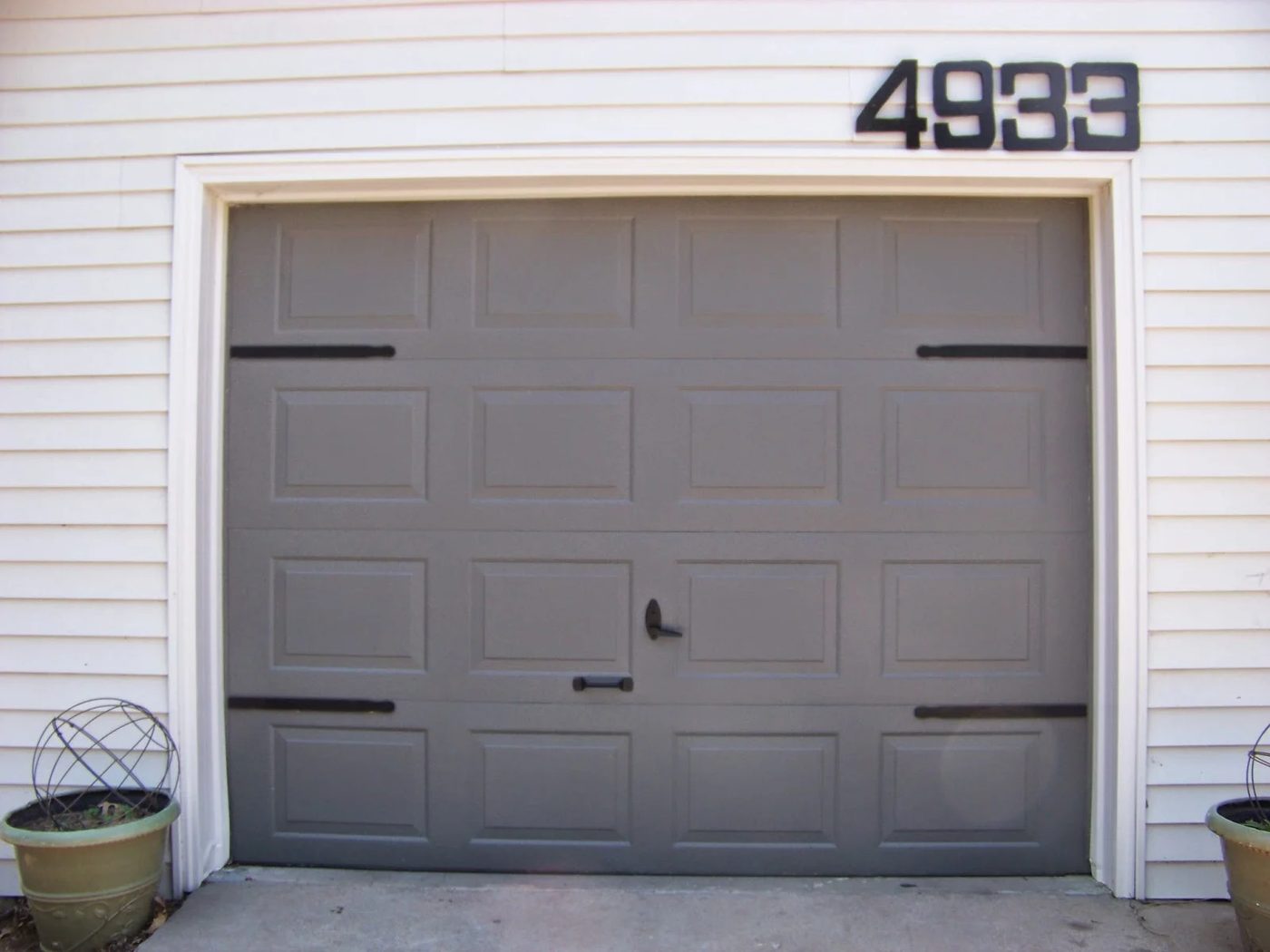 $5 Handmade garage door update - faux hinges using paint stir sticks - The Sunset Lane