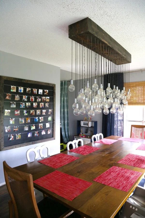 Love & Renovations dining room with multi-bulb Handmade light