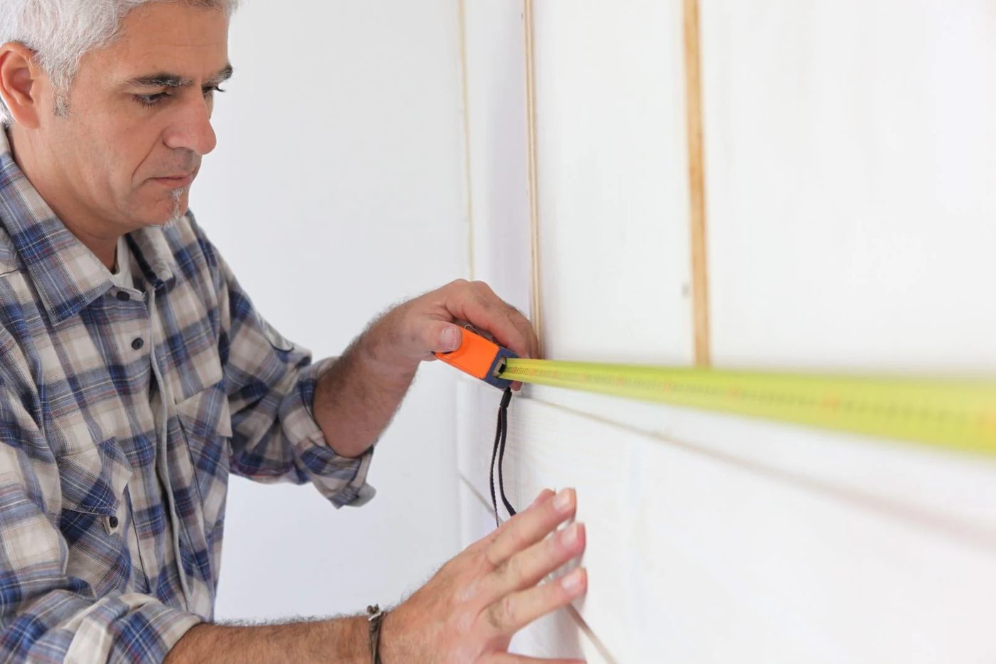 Putting Up Molding On Wall Shutterstock 139267586