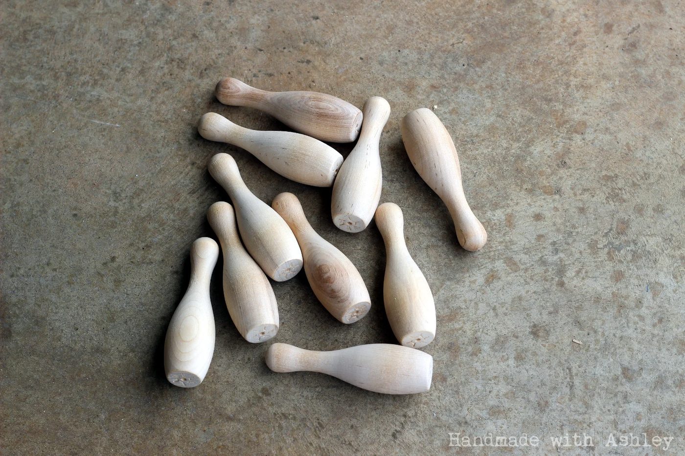 4 Miniature unfinished bowling pins for kid-sized bowling lane walkthrough, Handmade by Ashley featured on @Bekob
