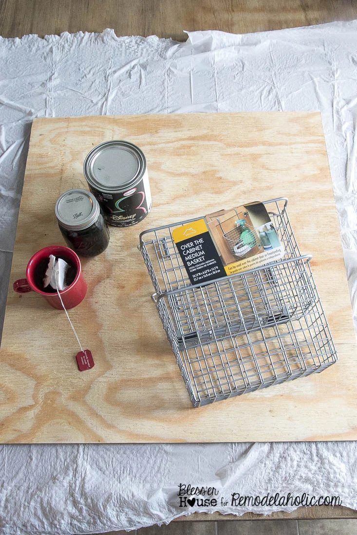 Handmade Locker Basket Mail Organizer -- homemade wood stain, straightforward painted chalkboard, plus low-cost Walmart baskets makes a great mail organizer!