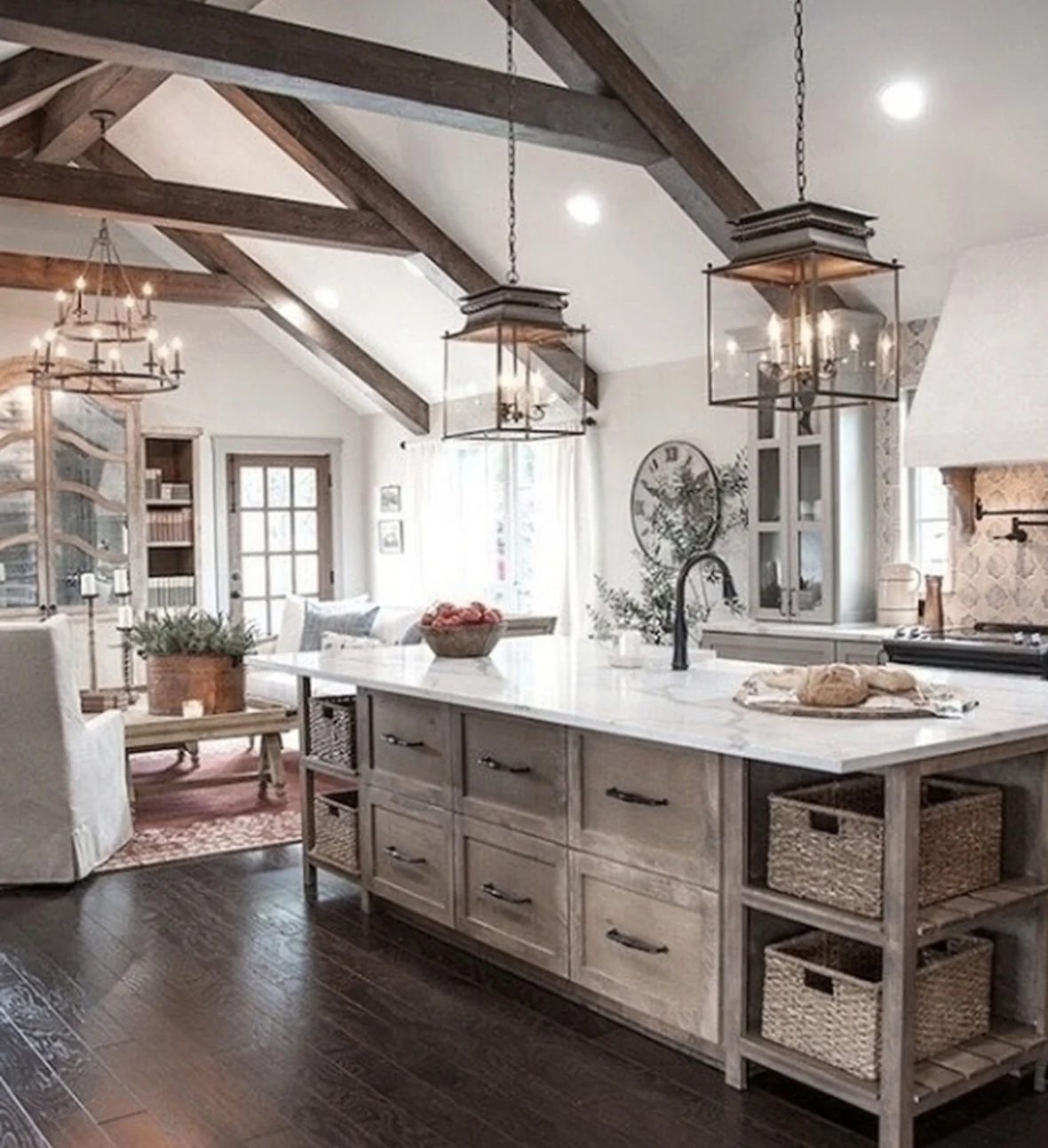 Wooden Farmhouse Kitchen With Drawers And Shelves In Island With Baskets And strong Ceilings And Light Fixtures