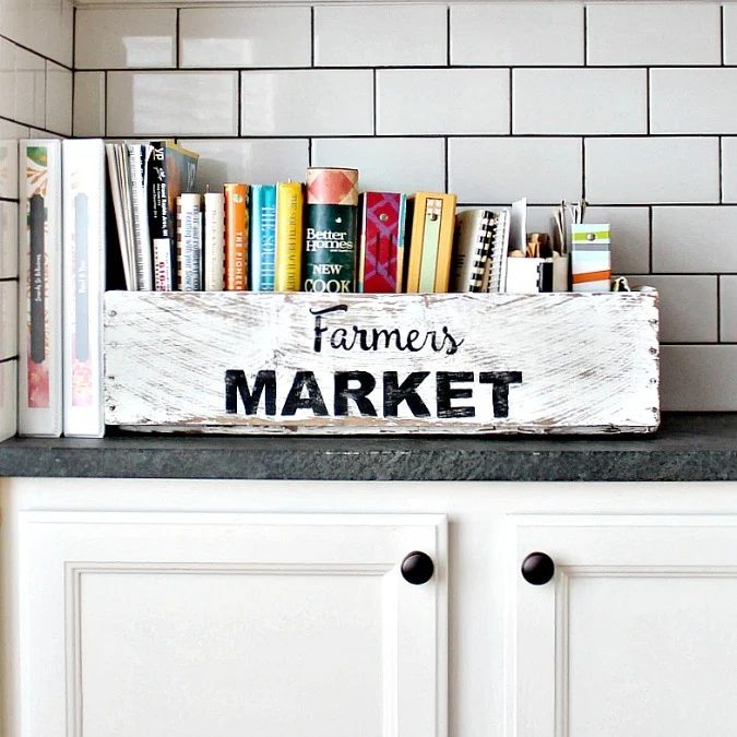 White Kitchen With White Wood Box Labeled Farmers Market Full Of Cook Books