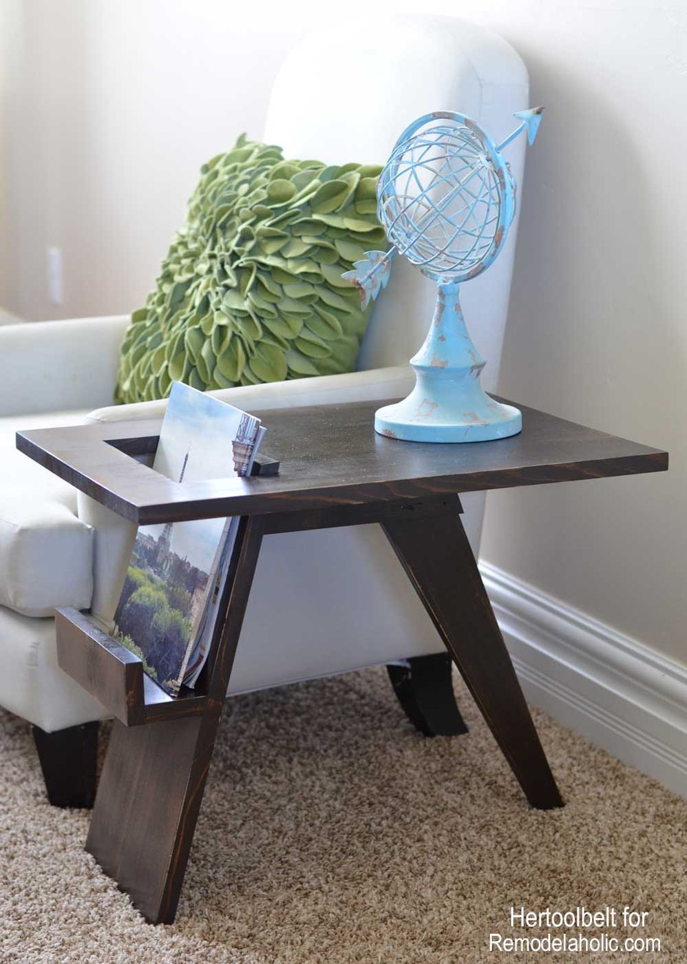 I love unexpected design features! Free plans to build a Mid-Century Modern side table with convenient magazine or book holder. Build this side table with only 1 board!